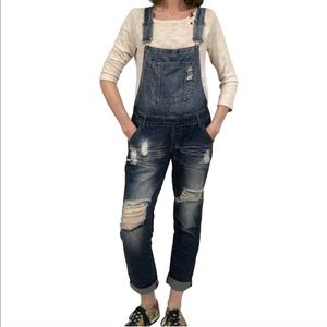 Machine destructed bib overalls